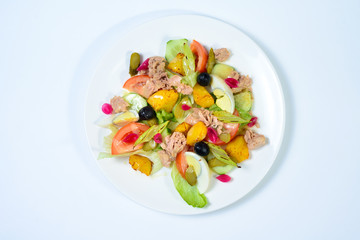 salad with meat,egg, tomatoes, olives and vegetables