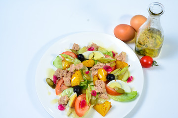 salad with meat,egg, tomatoes, olives and vegetables