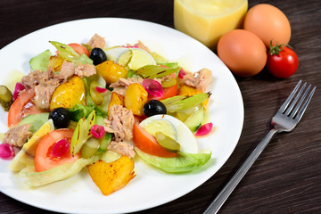 salad with meat,egg, tomatoes, olives and vegetables