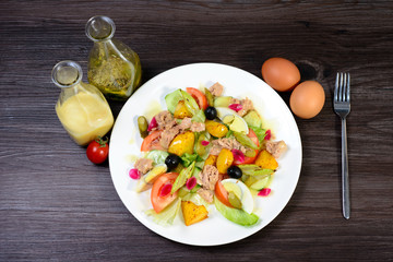 salad with meat,egg, tomatoes, olives and vegetables
