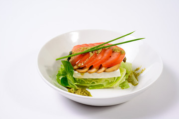 classic Caprese salad with tomatoes, cheese, herbs and sauce