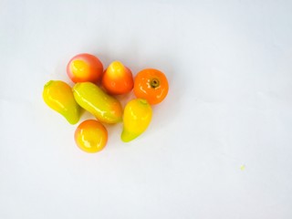 selective focus of deletable imitation fruits isolated on white background, soft focus of deletable imitation fruits