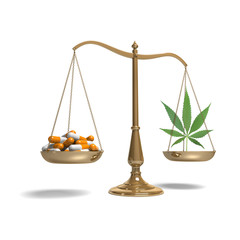 classic scale of justice with marijuana and pills