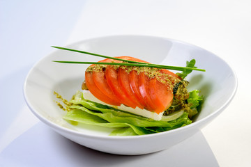 classic Caprese salad with tomatoes, cheese, herbs and sauce