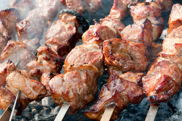 Brazier with the preparing shish kebab on skewers