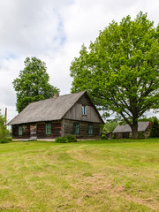 Fototapeta na wymiar country house with oak trees
