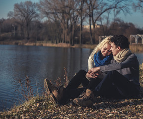 Lovers romantic couple in the picnic in the park near water