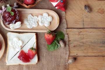 Fresh strawberries red and jam with bread.