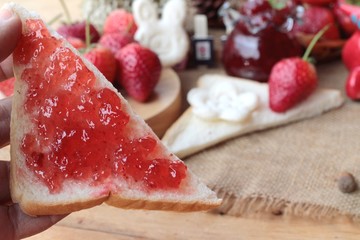 Fresh strawberries red and jam with bread.