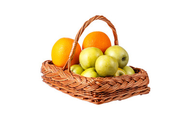 Basket with apples and oranges on a white background