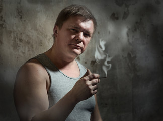 man smokes a cigarette