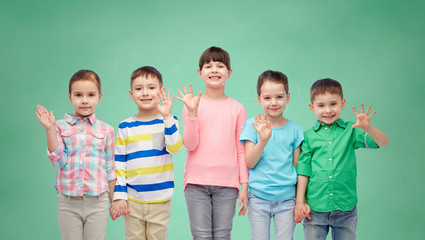Fototapeta na wymiar happy smiling little children holding hands