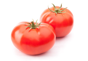 Two red tomatoes isolated on the white background with clipping path