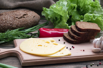 black bread , cheese and fresh herbs