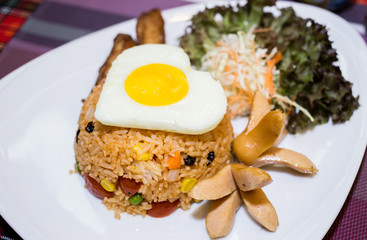 Close up American fried rice served with green cos lettuce