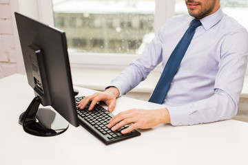 close up of businessman hands typing on keyboard