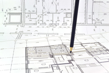Plan and planning designed building with a pencil on the drawing