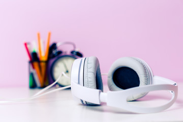 Headphones on lilac background