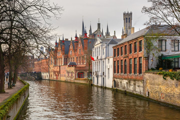 Scenic winter cityscape with a medieval tower Belfort and the Green canal, Groenerei, in Bruges, Belgium