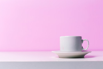 Cups on lilac background