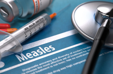 Measles - Medical Concept with Blurred Text, Stethoscope, Pills and Syringe on Blue Background. Selective Focus. 3D Render. - obrazy, fototapety, plakaty