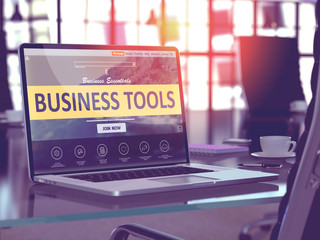 Business Tools Concept. Closeup Landing Page on Laptop Screen  on background of Comfortable Working Place in Modern Office. Blurred, Toned Image. 3D Render.