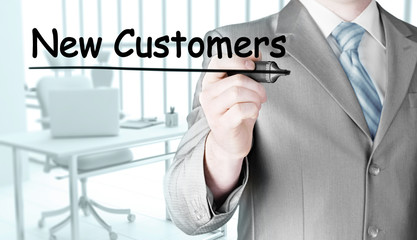 businessman writing new customers