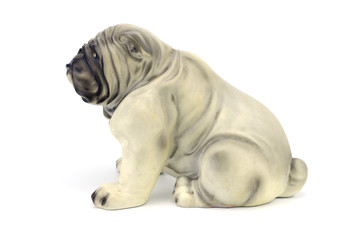 Fototapeta na wymiar Statuette of dog isolated on white background