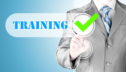 Fototapeta premium Businessman pressing touch screen interface training checkbox