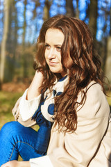 Stylish hipster smiling girl in the park outdoor portrait