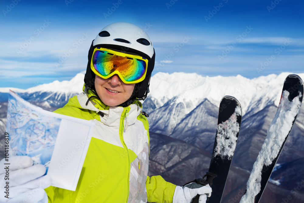 Wall mural woman with ski track map on the mountain