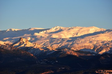 Fototapeta na wymiar sunset and mountain snow