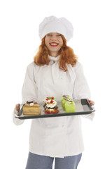 Female baker chef with Christmas pastries