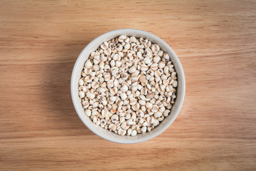 bowl of millet on the wood background