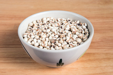 bowl of millet on the wood background