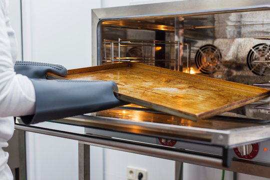Cook handling oven tray