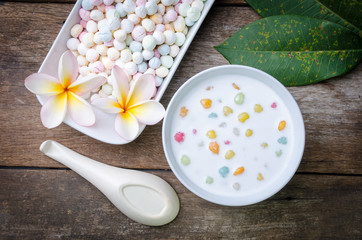 Obraz na płótnie Canvas Colorful candies dumplings in coconut cream