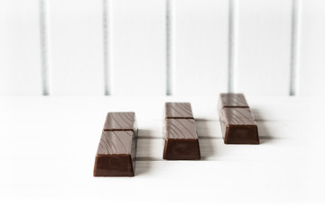 Three chocolate bars on white background 