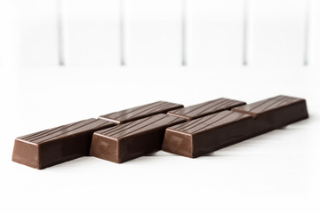 Three chocolate bars on white background 