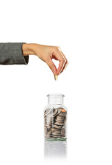 hand putting a coin in jar, saving money