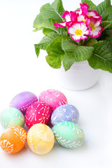 Colorful Easter eggs and spring flowers