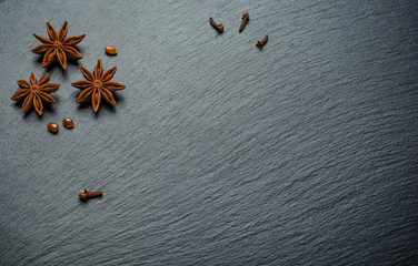 Cinnamon sticks, anise on a stone plate