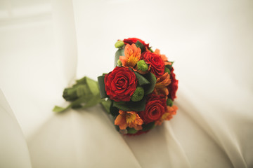 Beautiful luxury wedding bouquet of red flowers