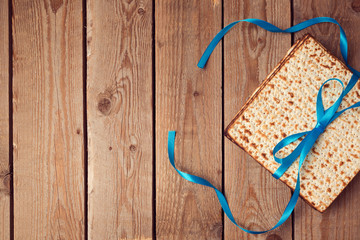 Matzoh for jewish holiday Passover (pesah) on wooden background. View from above