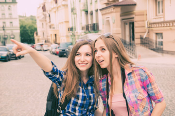 Two beautiful girlfriends walking on the tour