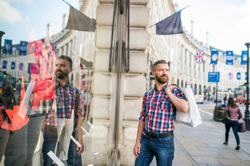 Hipster man shopping in the streets of London