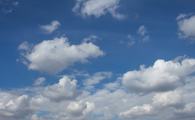 Naklejka na ściany i meble White puffy clouds on the background blue sky