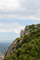 Fototapeta na wymiar Cliff with Cross of St. Miquel near Montserrat Abbey, Spain.