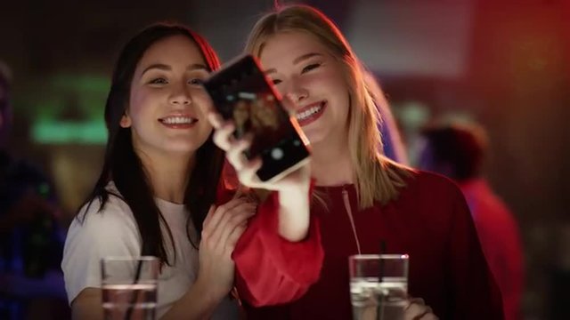 Girls in the disco taking selfie