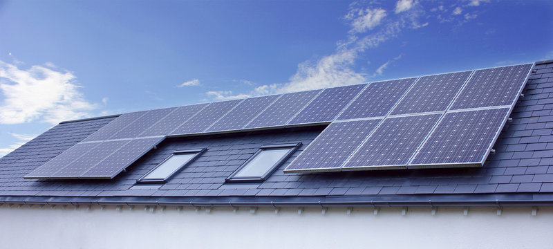 Solar Panels On House Roof. Sustainable Renewable Energy